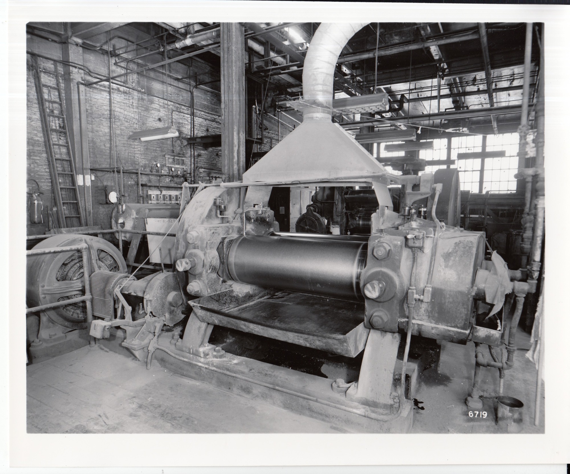 Edison Storage Battery Division, rubber plant building, interior, extruder.