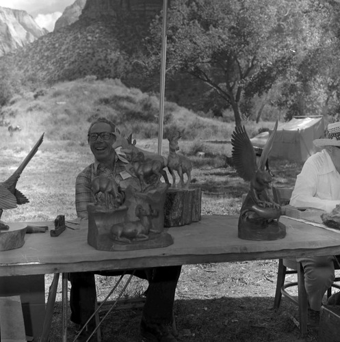 Leo Fesler and his wildlife carvings at the second annual Folklife Festival, Zion National Park Nature Center, September 7-8, 1978.