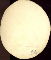Brigadier General George Armstrong Custer in Military Uniform; Long Bust View. LIBI_00019_00318; This item is a card-mounted albumen photograph of Brigadier General George A. Custer in long bust view.  This oval-shaped photograph is 5 7/8
