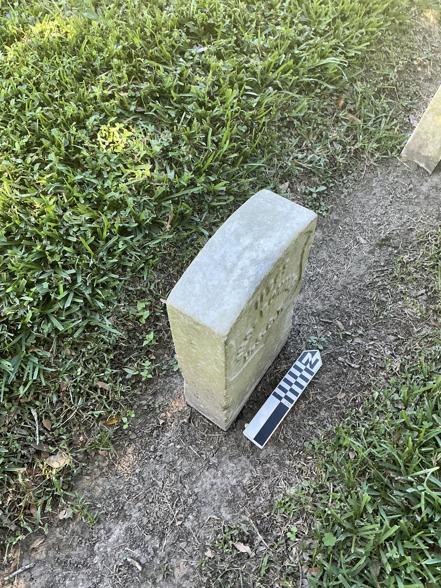 Extra image of historic upright marble headstone with recessed shield face.