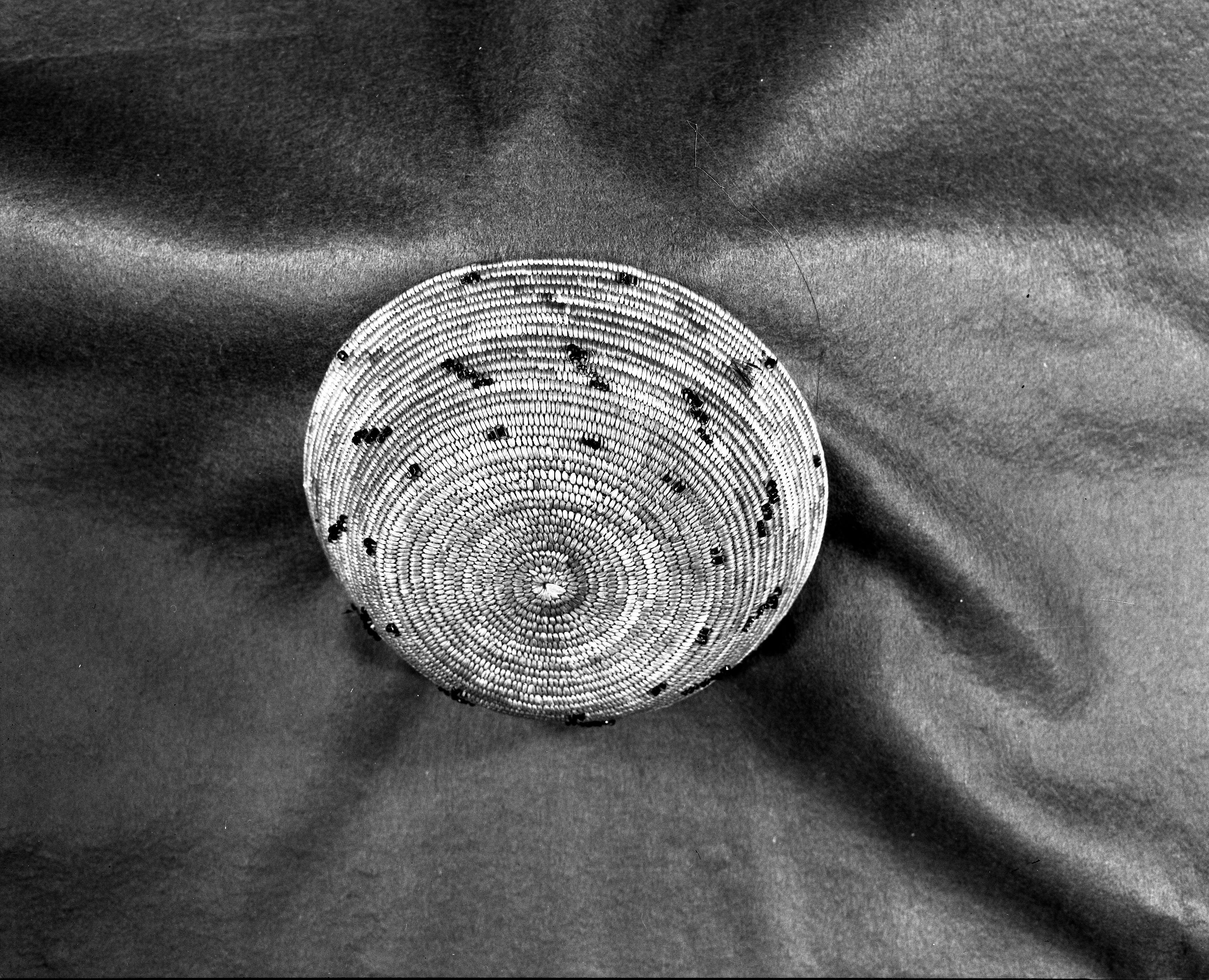 Salinan basket, sedge root, glass beads, grass bundle foundation. Note remnents of mallard duck feathers. Probably by Perfecita Encinales or a member of her family. In the collection of Marion Steinbach. c. 1910? Filter - 2 1/2. Exposure - 5 sec F11 16" (8 x 10).