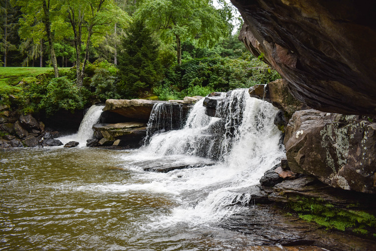 a small, wide cascading waterfall