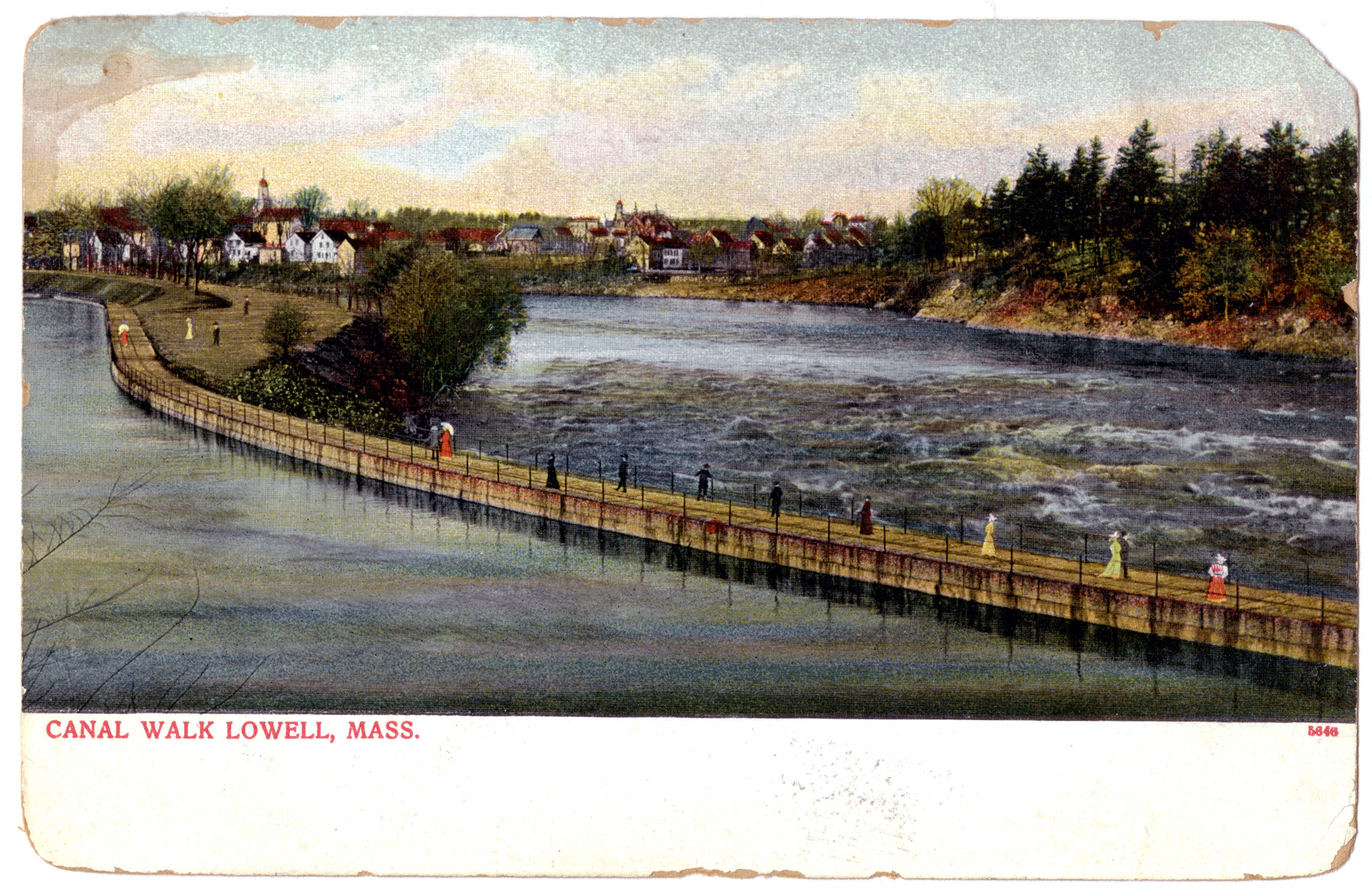Women promenade along a canal