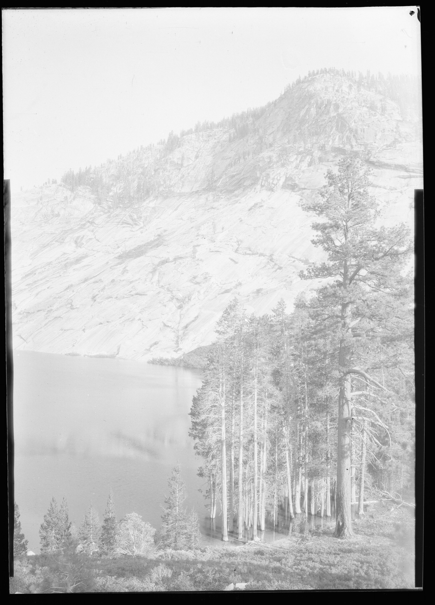 Lower end of Lake Merced, glaciated cliff opposite. Yosemite Park, Cal.