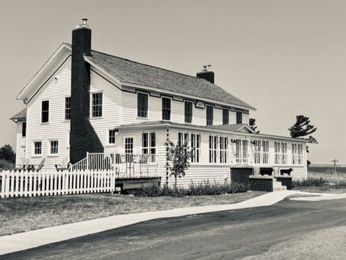 The Sleeping Bear Inn that is in Glen haven it is sitting in the sun on a hot day