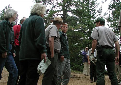 President Bush speaks with Secretary of Interior Norton, NPS Director Mainella, and Deputy Director Jones at Rocky Mountain National Park