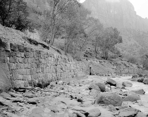 Flood damage to rock wall on Virgin River, a quarter mile south of Court of Patriarchs. Record of damage or defective workmanship.