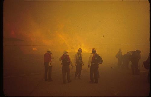 Firefighters provide structural protection to commercial buildings during the Bircher fire, Mesa Verde National Park, July 2000