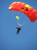 A BASE Jumper drops to the river