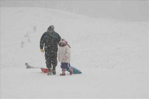 Sledding at Kendall Hills Adult and Child