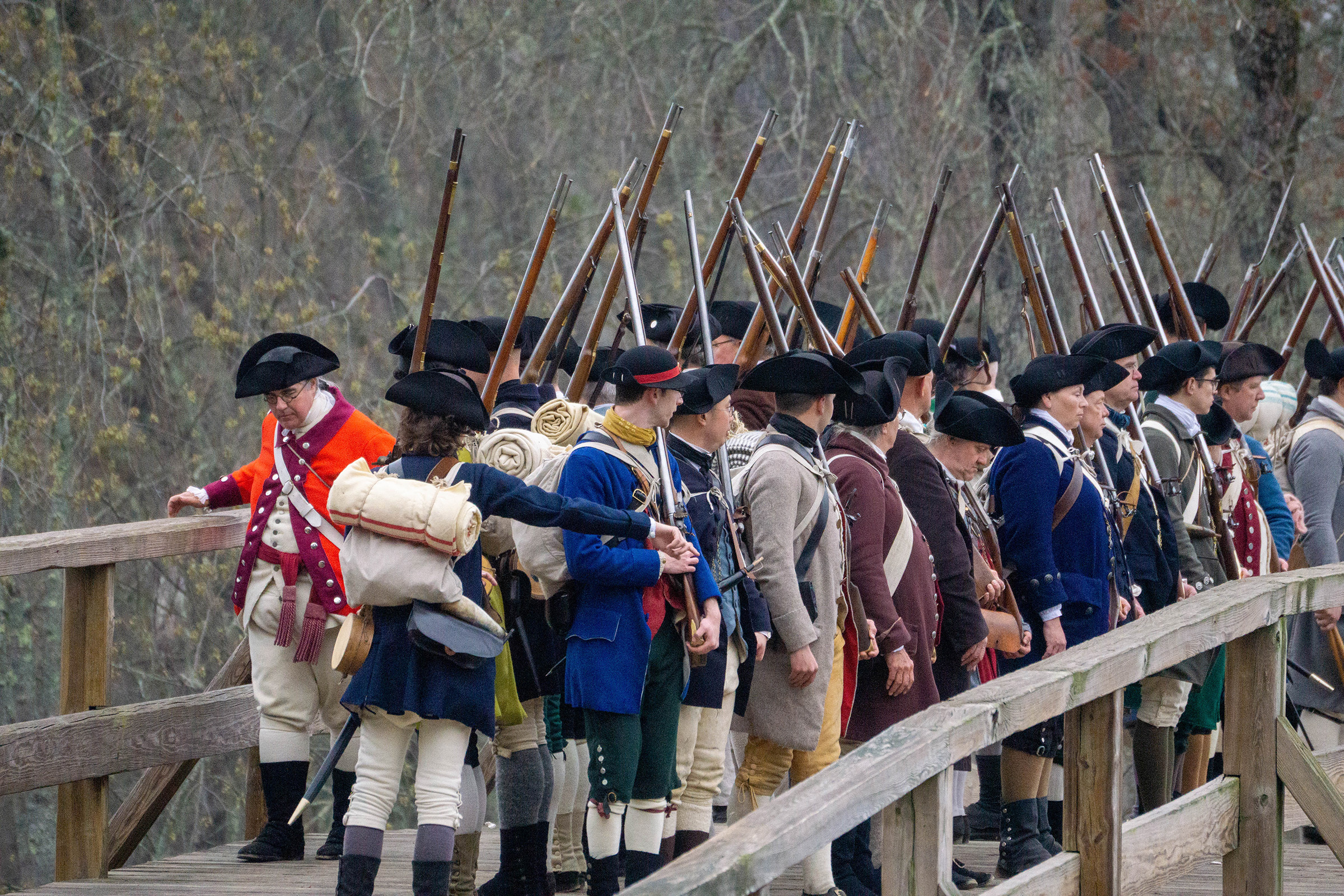 Militia men preparing to fire a musket salute off the North Bridge