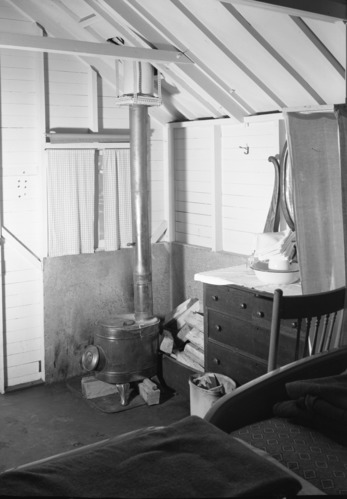 Stoves in Yosemite Lodge cains with bent legs and loose stovepipe connection.