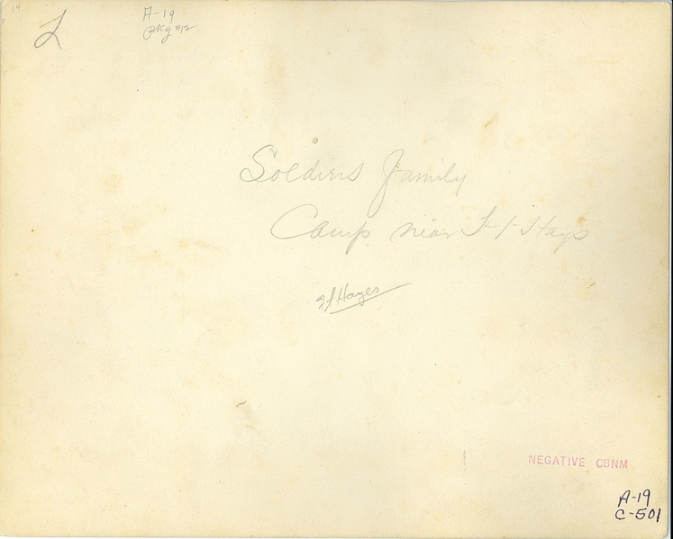 Unidentified Soldier and His Family in Front of Two Tents, 7th Cavalry Camp Near Fort Hays, Kansa