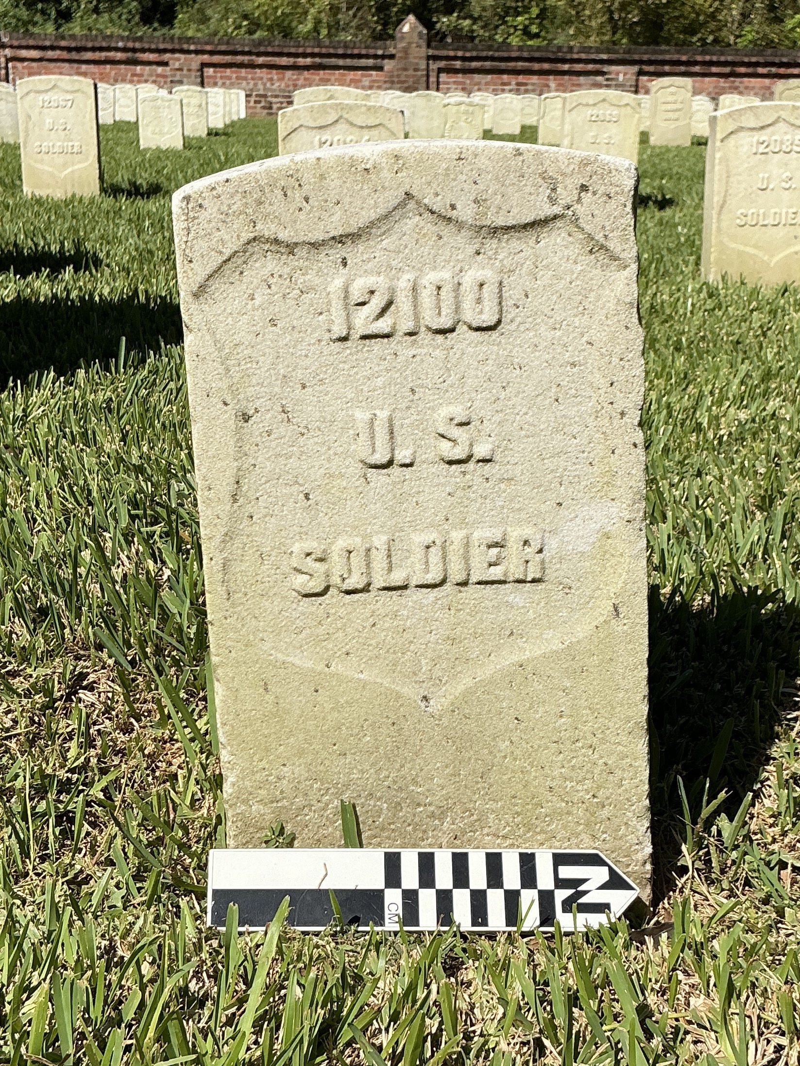 Extra image of historic upright marble headstone with recessed shield face.