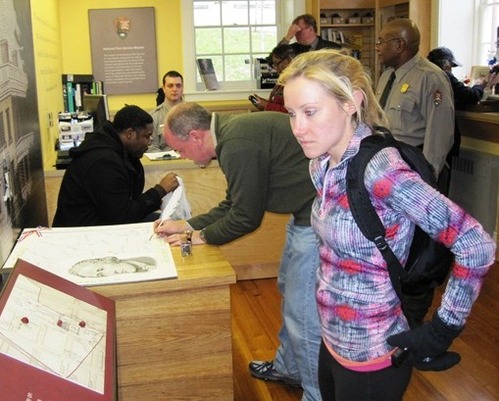 Visitor signing Alexander Hamilton birthday card