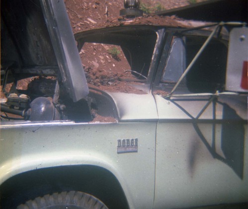 Color photo of an engine fire in a pickup.