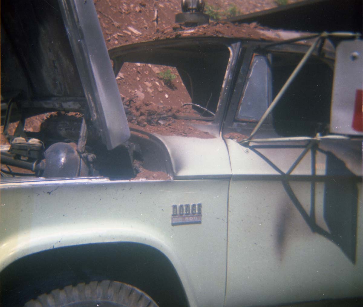 Color photo of an engine fire in a pickup.