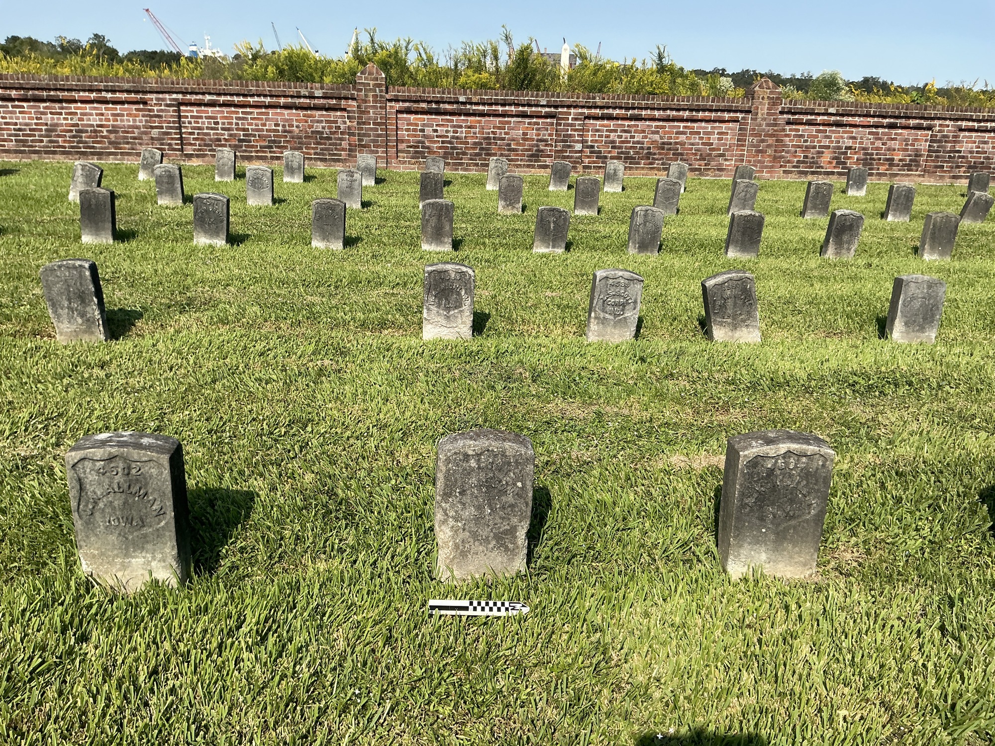 Extra image of historic upright marble headstone with recessed shield face.