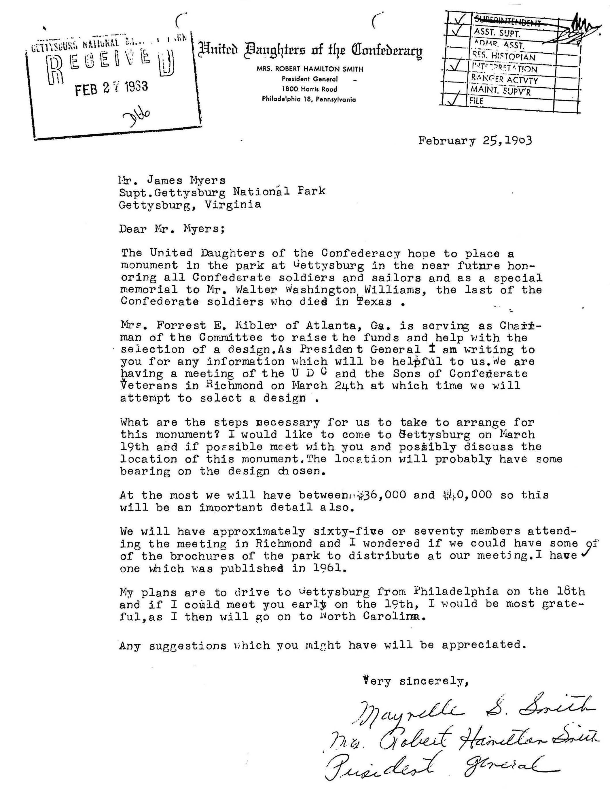 White paper with typed black text and a handwritten signature