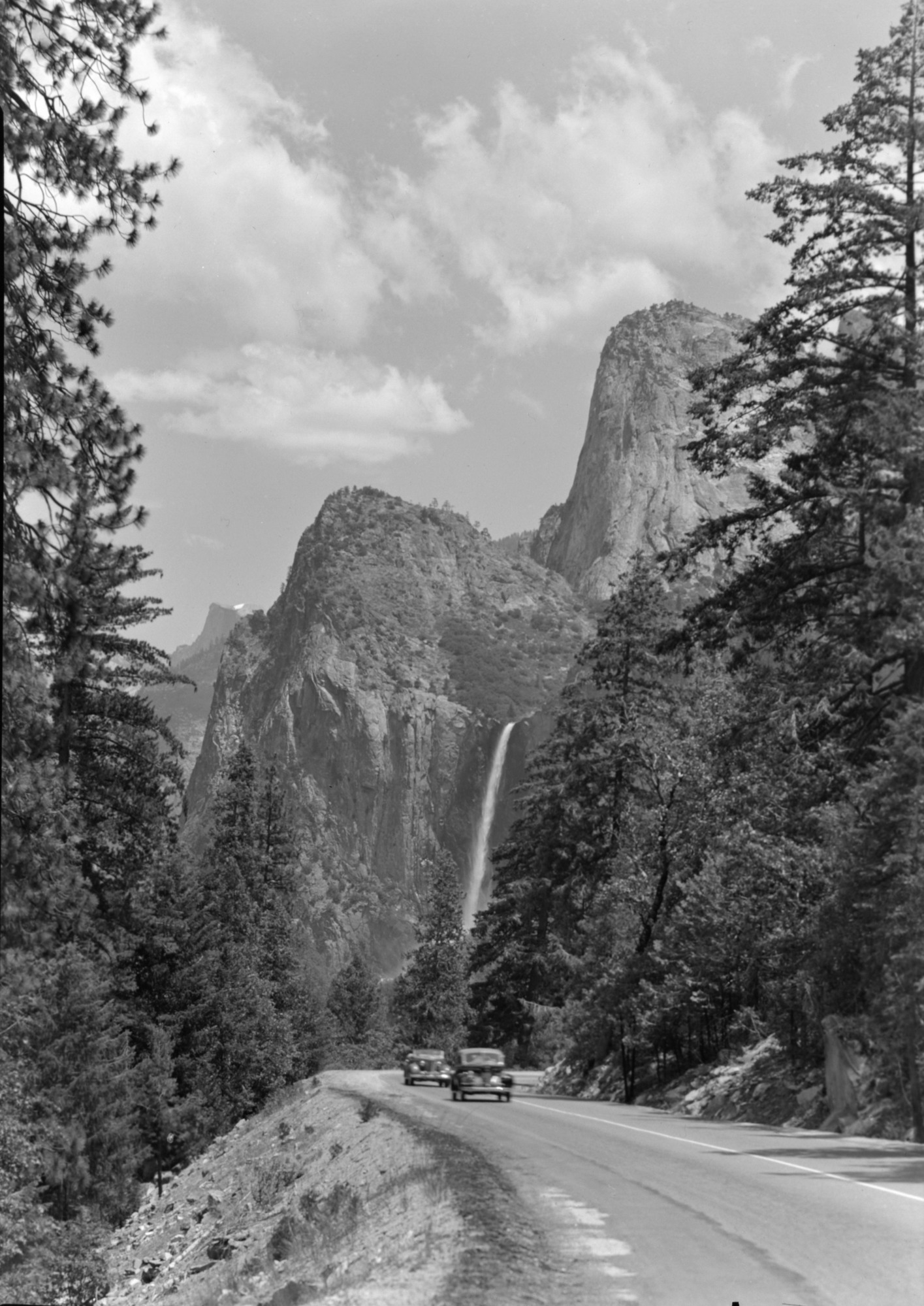 Cars on Wawona Rd. with Bridalveil Fall.
