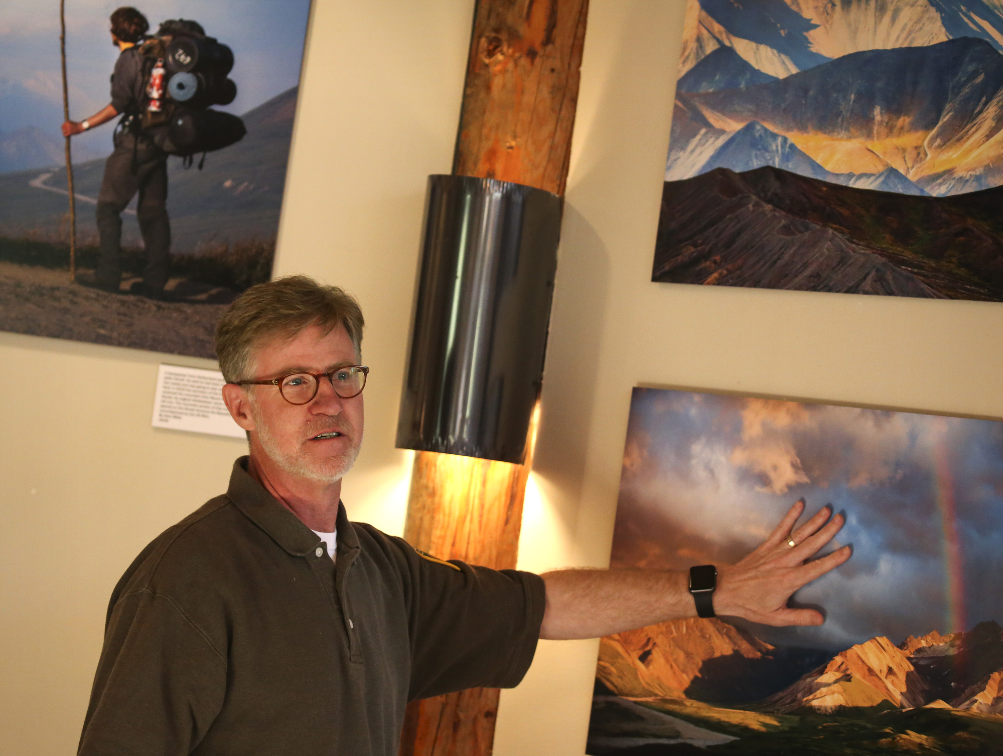 man in volunteer ranger uniform speaking to people