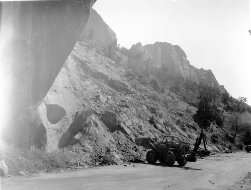 Flood damage repair - Zion Canyon, December 1966 flood. Tractor moving debris. Between Birch Creek and Pine Creek on scenic drive.