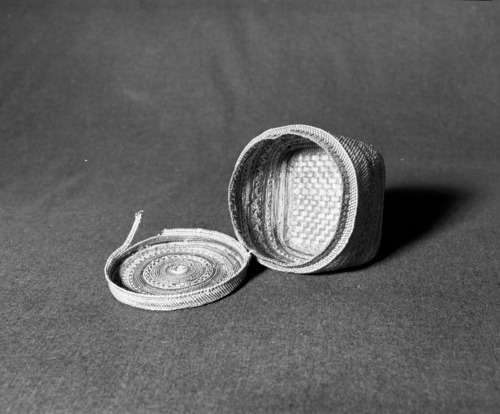 Marie Rozier Collection, Catalog No. 125. Object: Quinault basket. Dimensions: 5 x 4". Materials: Red cedar, grass. Technology: Interior shows bright purple and green dyes used, now faded on exterior. Collection History: Acquired from Ora Doyle. Photographed by Michael Dixon, December 1982. Catalogued by Craig Bates and Barbara Beroza. Yosemite Collections, National Park Service.