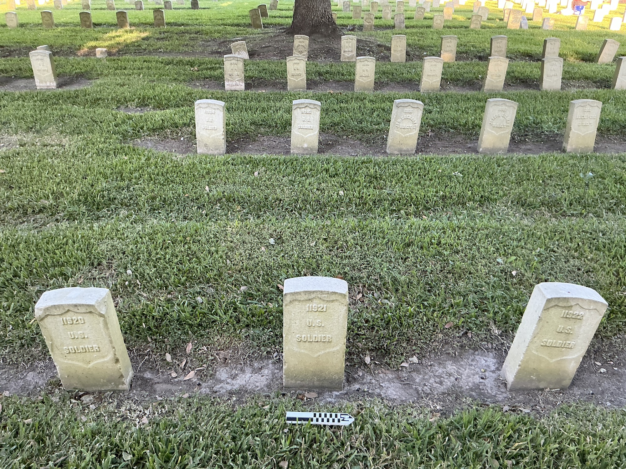 Extra image of historic upright marble headstone with recessed shield face.
