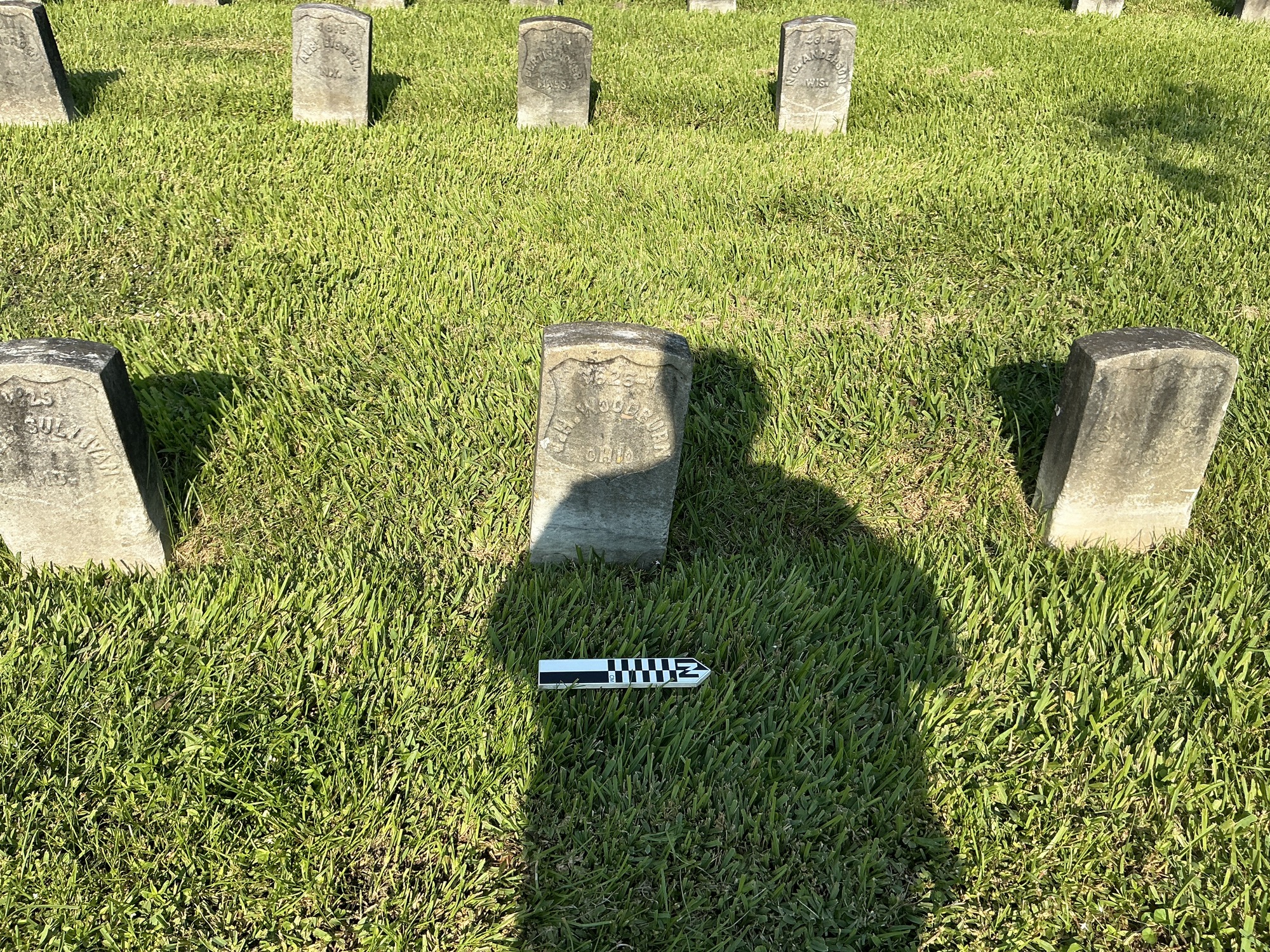 Extra image of historic upright marble headstone with recessed shield face.