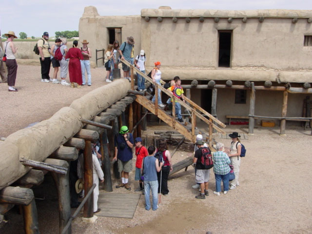 Students descending the ladder at Bent's Old Fort National Historic Site