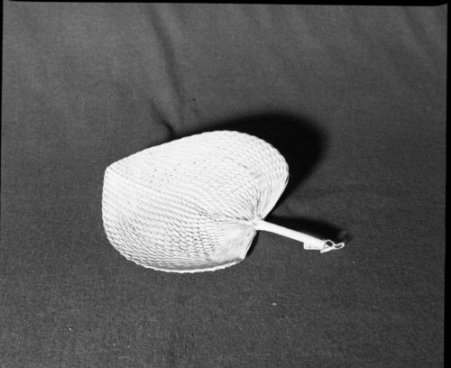 Marie Rozier Collection, Catalog No. 2A-12. Object: Fan. Dimensions:13". Materials: Pandanus, palm leaf, plastic. Collection History: Nedi, Fiji. Photographed by Michael Dixon, December 1982. Catalogued by Craig Bates and Barbara Beroza. Yosemite Collections, National Park Service.