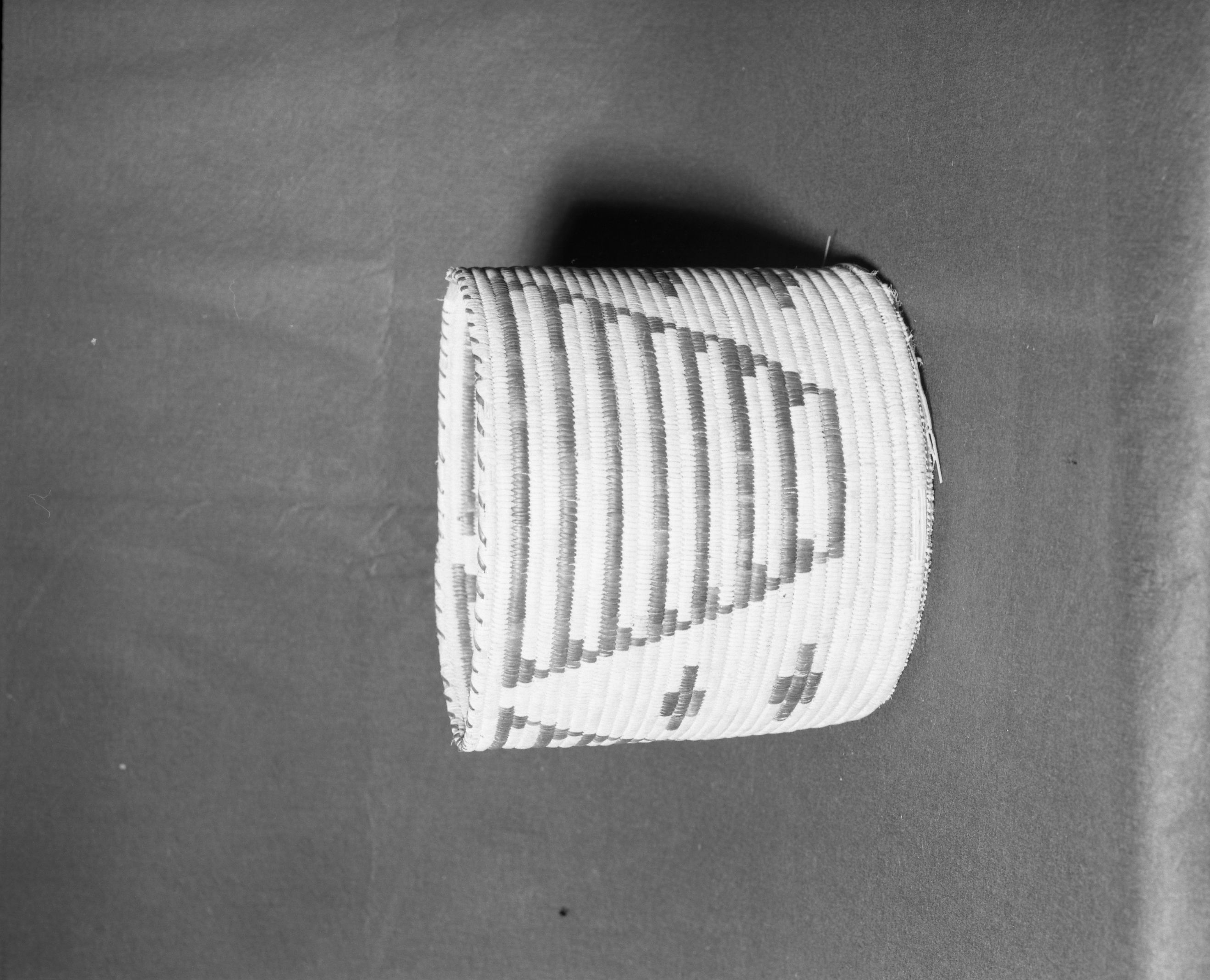 Mrs. Donald Segerstrom Collection. Object: Papago wastepaper basket. Dimensions: 12 x 10 1/2". Materials: yucca, devil's claw, joshua tree root. Technology: ---. Collection History: ---. Photographed by Michael Dixon, 1/83. Catalogued by Craig Bates and Barbara Beroza. Yosemite Collections, National Park Service.