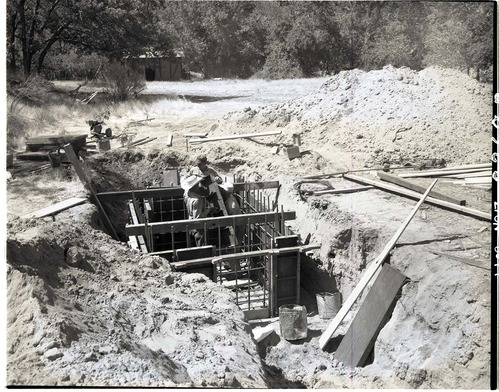 Water supply system - mouth of Birch Creek- excavating trench for water line.