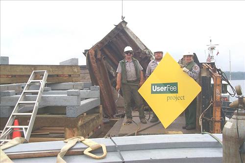 Dock construction using barge at Tookers Island, Isle Royale, 1999