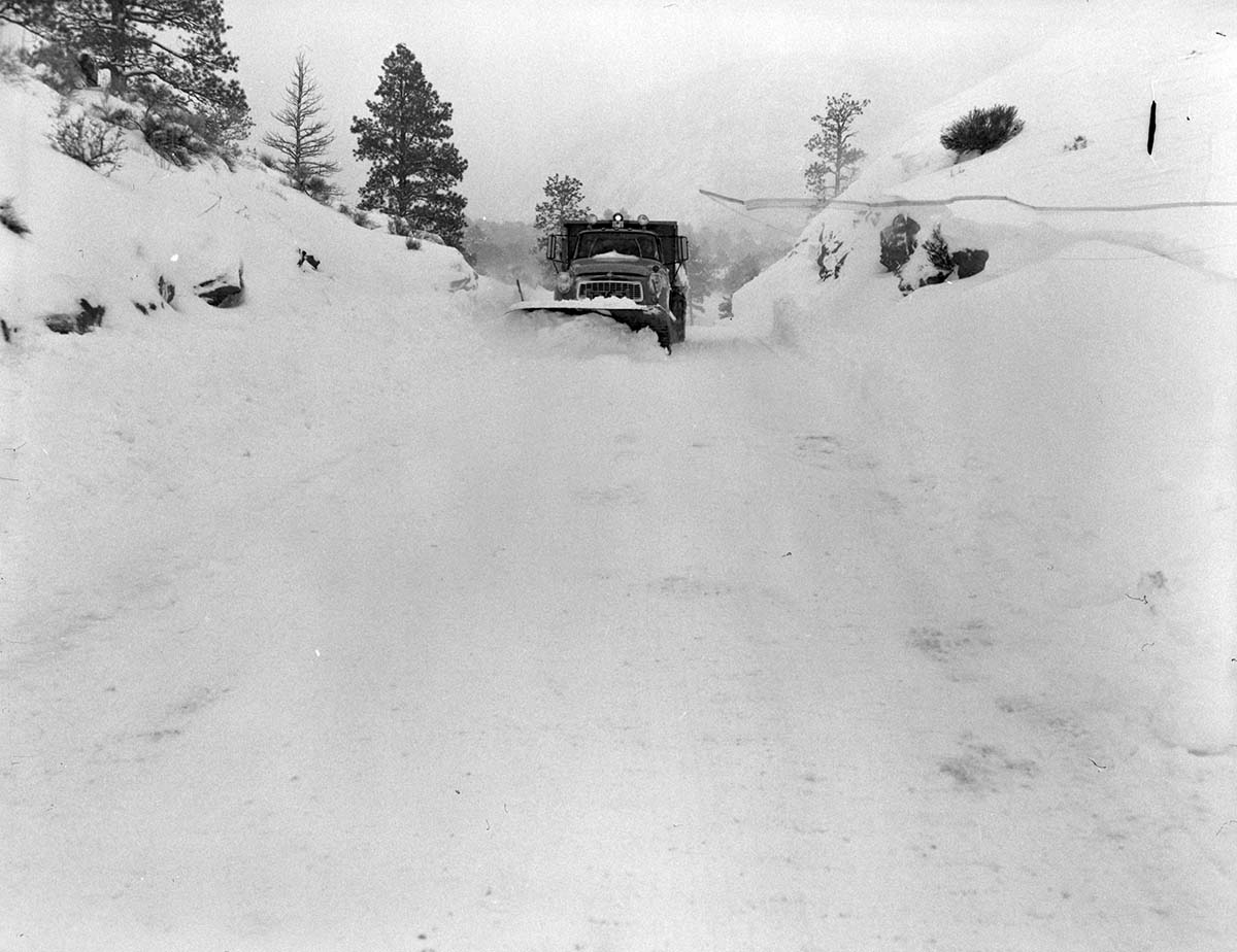Snow plow removing snow after a snow slide on Checkerboard Mesa.
