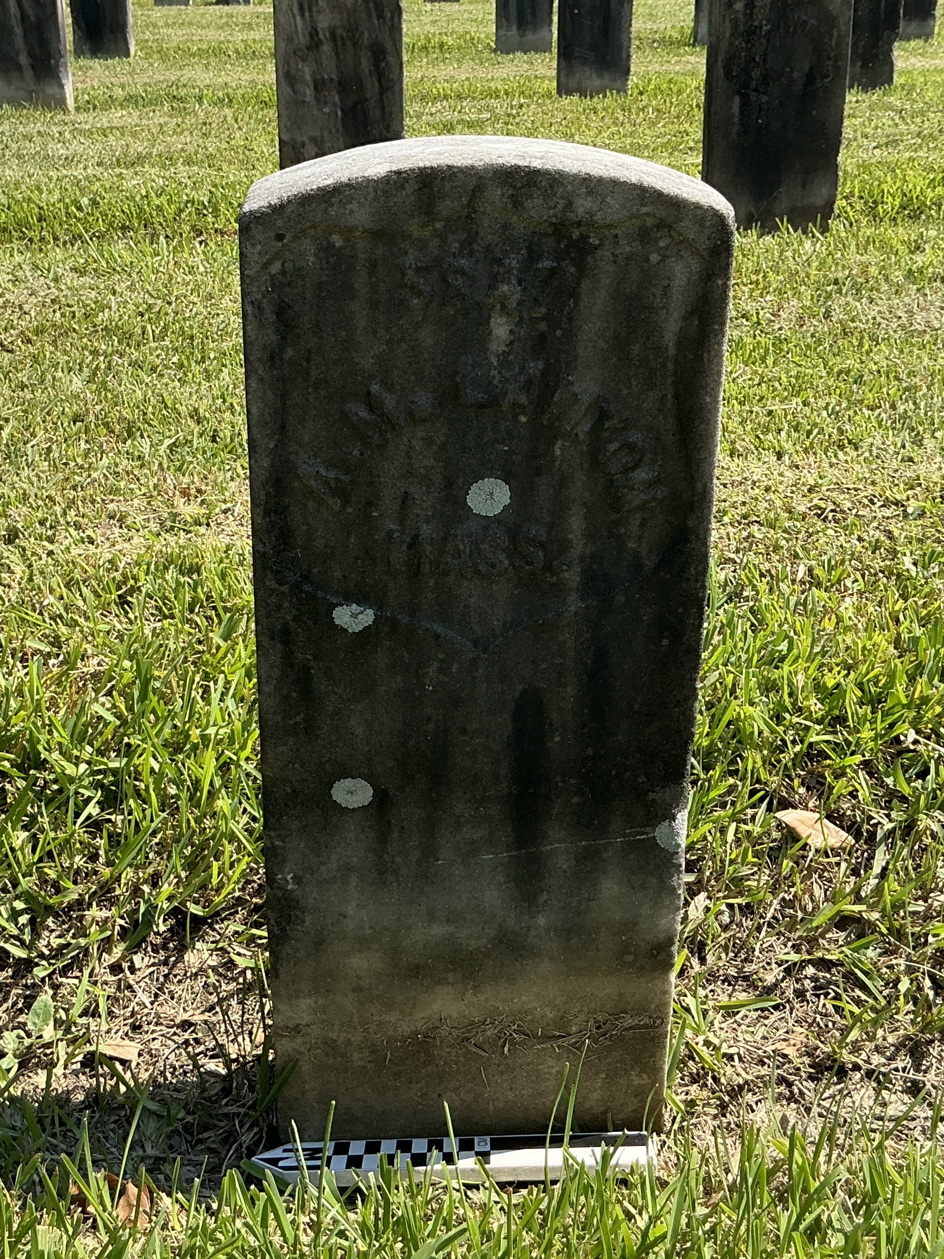 Extra image of historic upright marble headstone with recessed shield face.