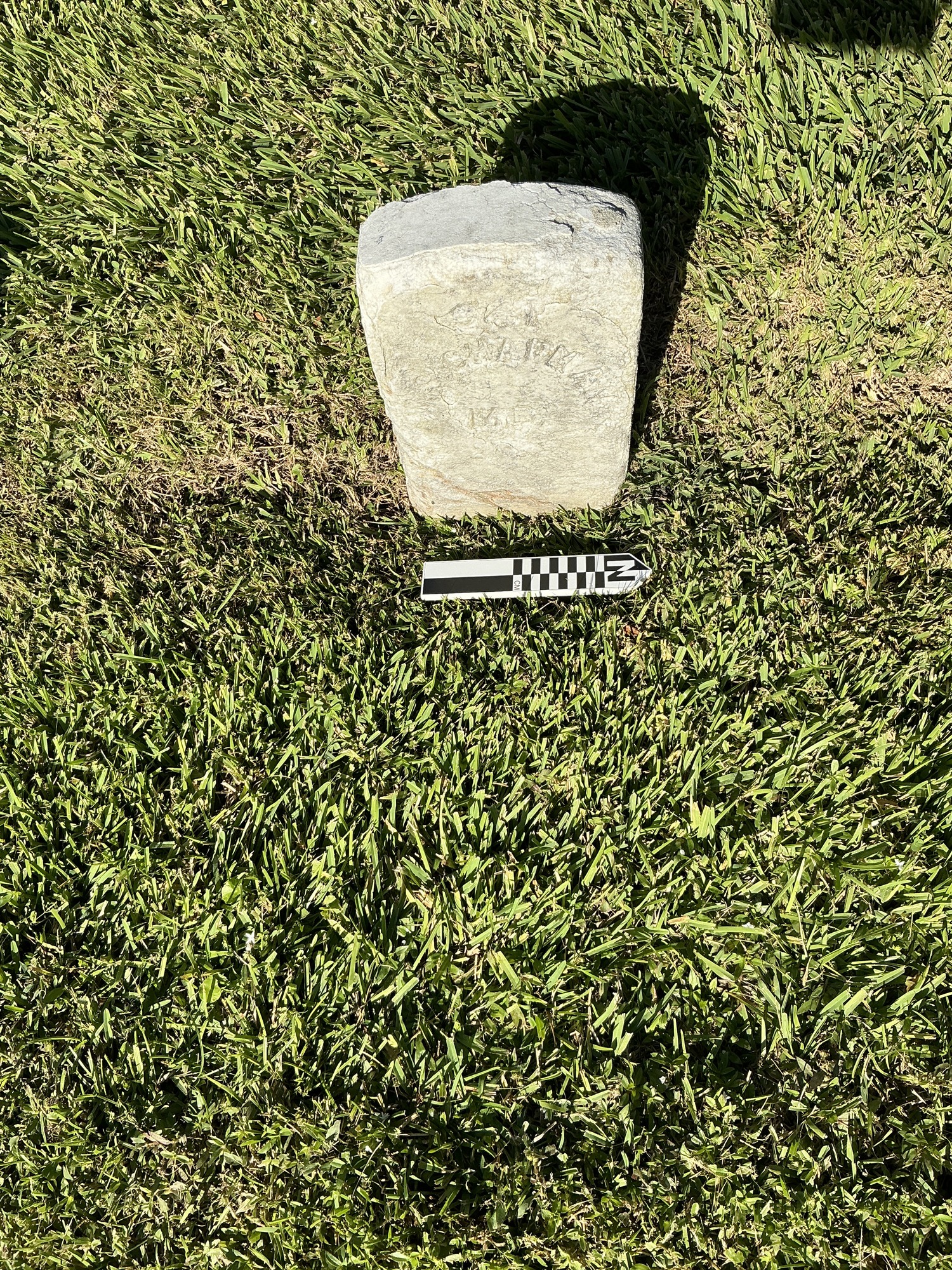 Extra image of historic upright marble headstone with recessed shield face.