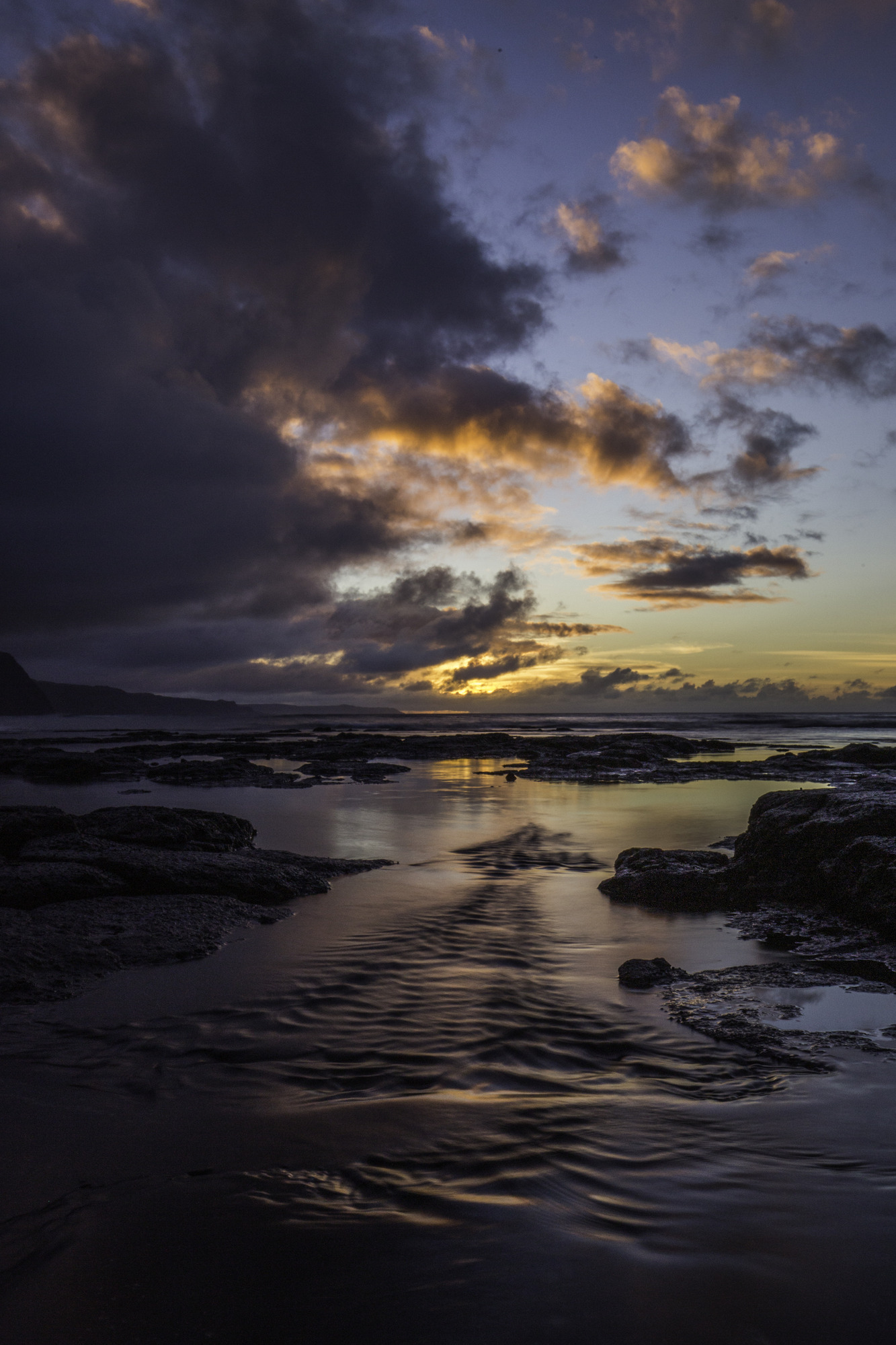 A colorful sky and reflection off the ocean 