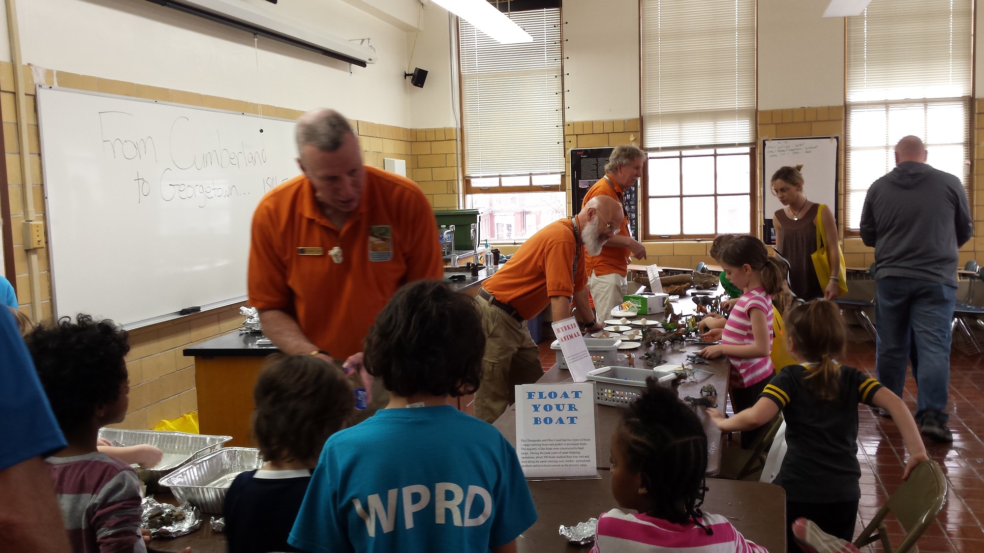 Students engaged with CCC teachers during an educational program.