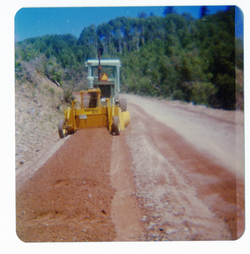 Construction vehicle performing road work along the Kolob Terrace Road.