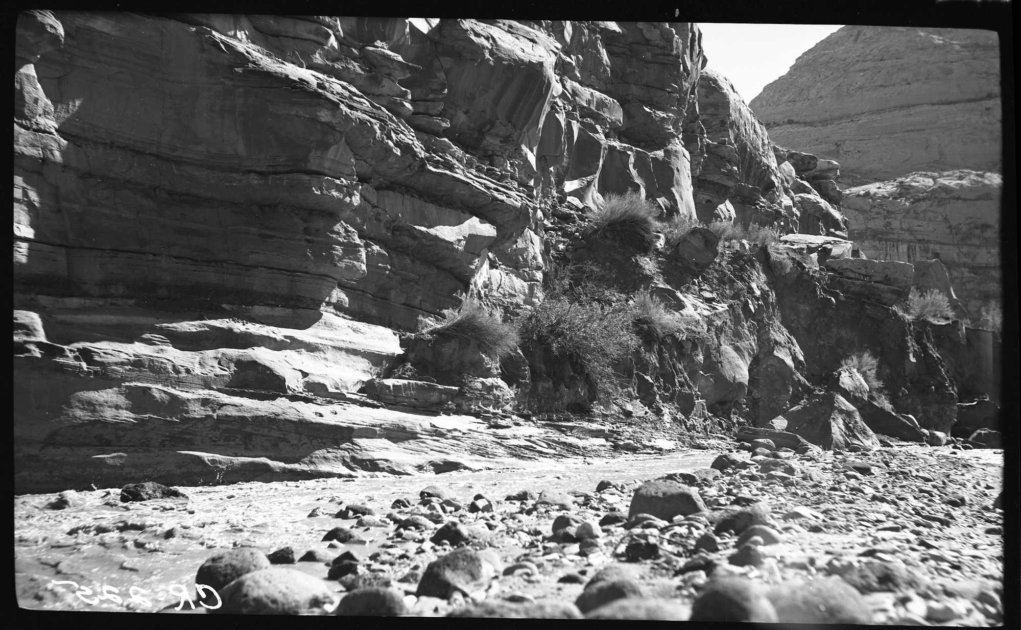 Cliff, river, and rocks. 