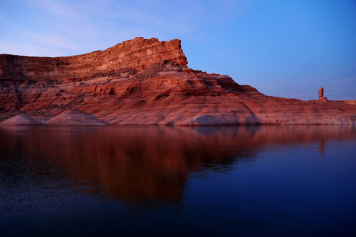 Swoopy rocks blue water