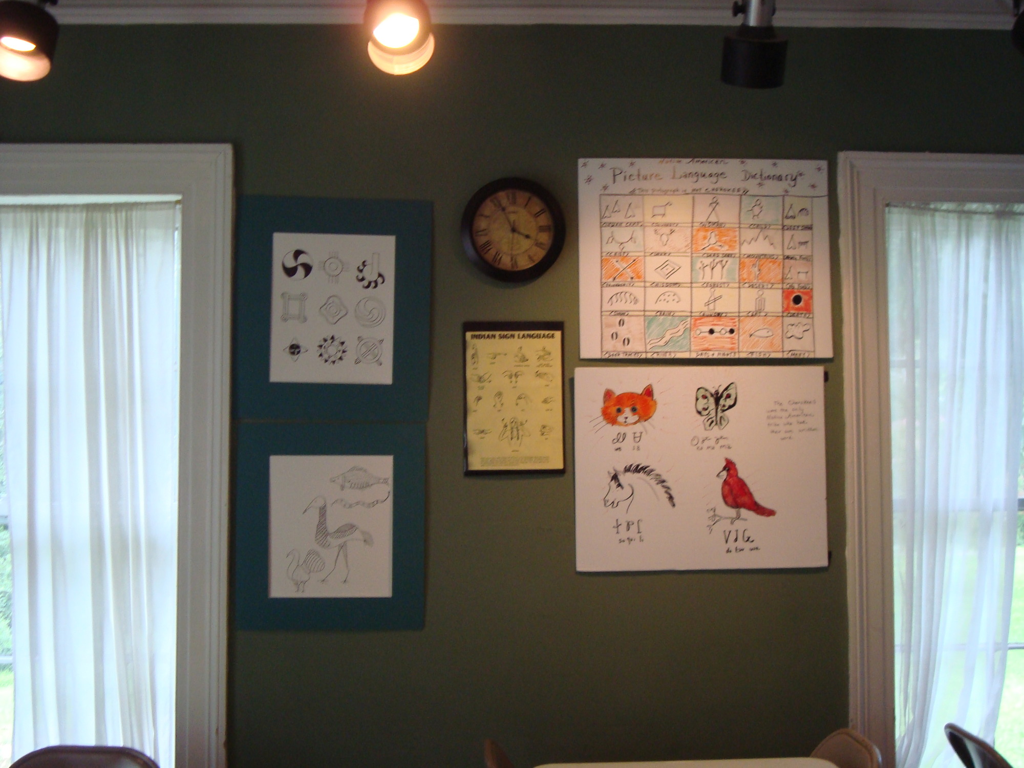 A room with a clock and other items on the wall.