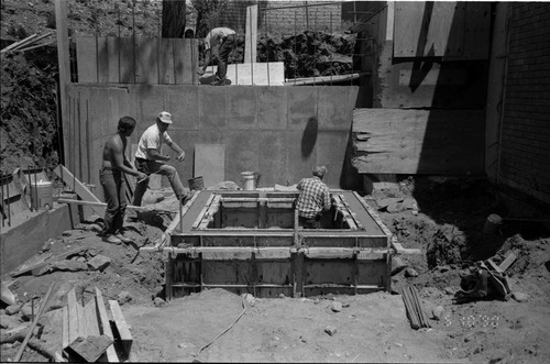 Workers during the construction of headquarters addition.