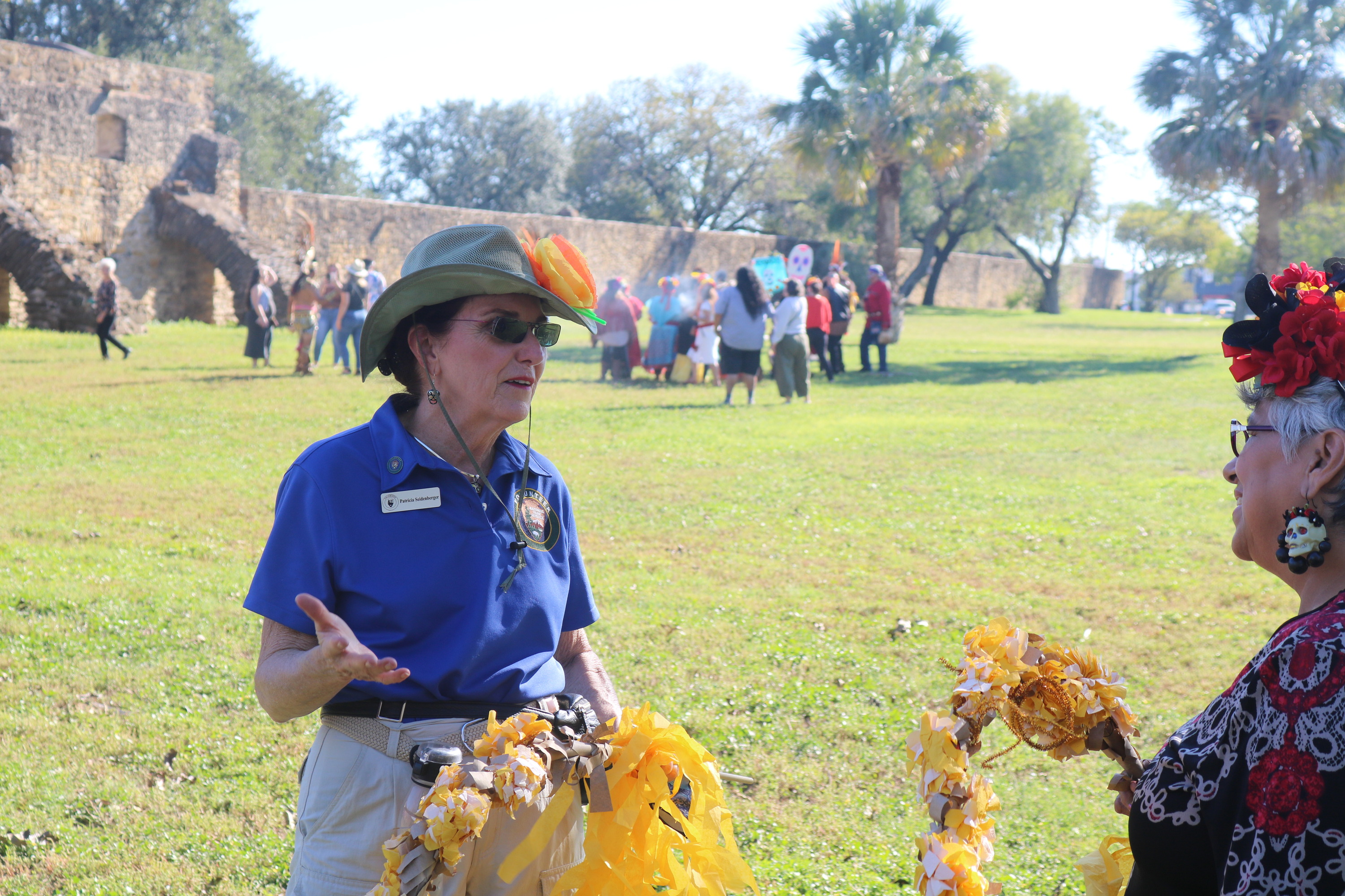 NPS volunteer talking to a community member. 