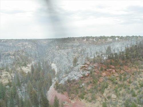 Aerial views of Chapin Mesa area in and around buildings depicting burn areas in the aftermath of the Long Mesa Fire at Mesa Verde National Park, August 2002