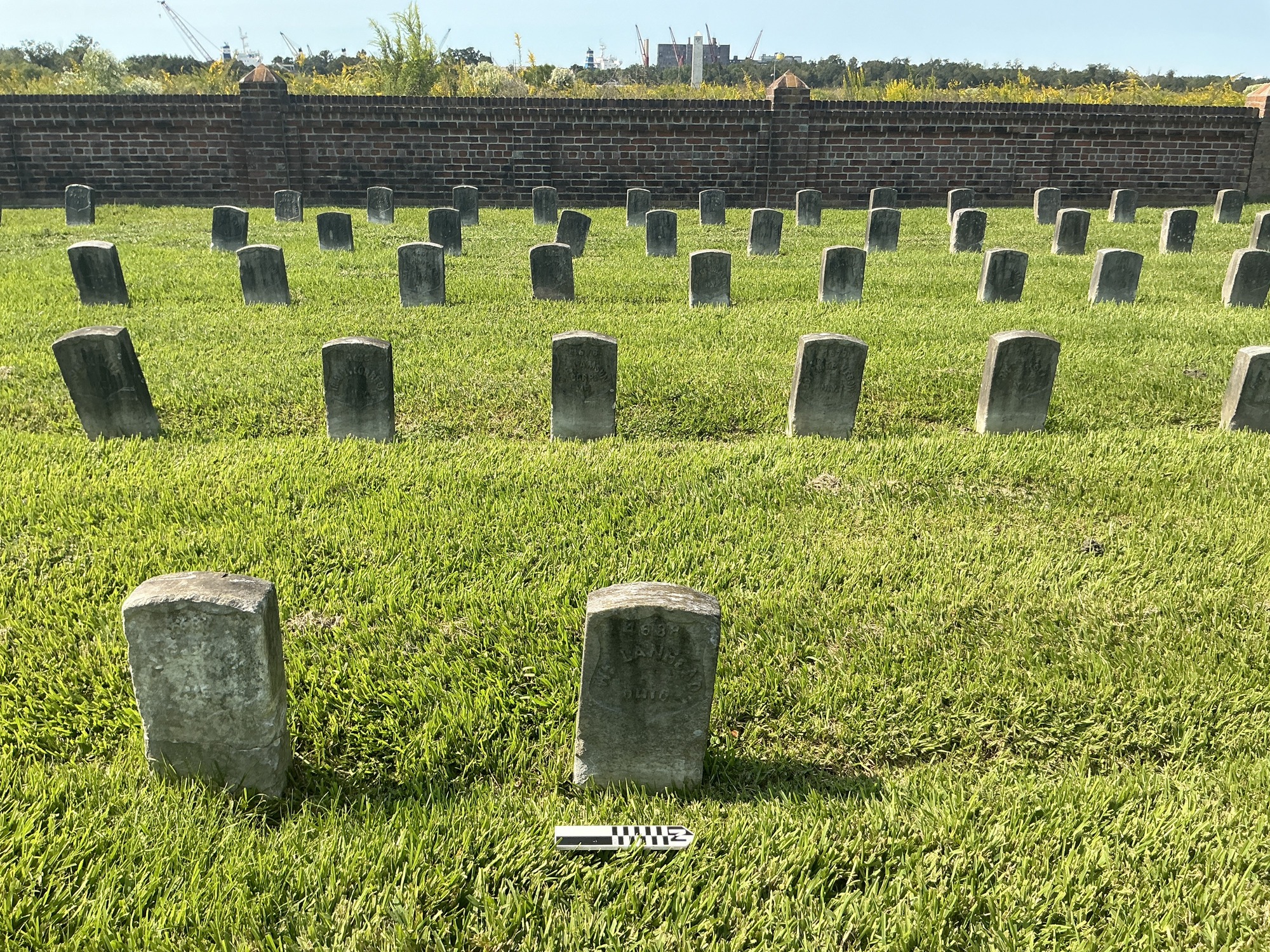 Extra image of historic upright marble headstone with recessed shield face.