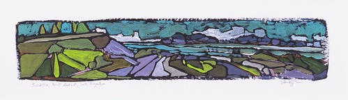 An artist's colorful painting shows a lake scene