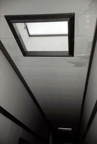 Ceiling and skylights in hallway of barracks. [Image possibly for comparative housing study]