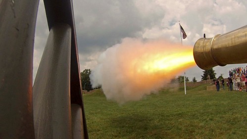 Flame erupts from a cannon muzzle.